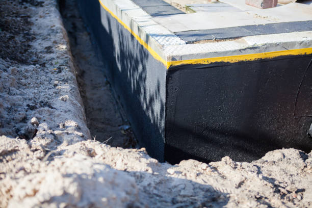 Professional Waterproofing technician working in Carrollton, AL